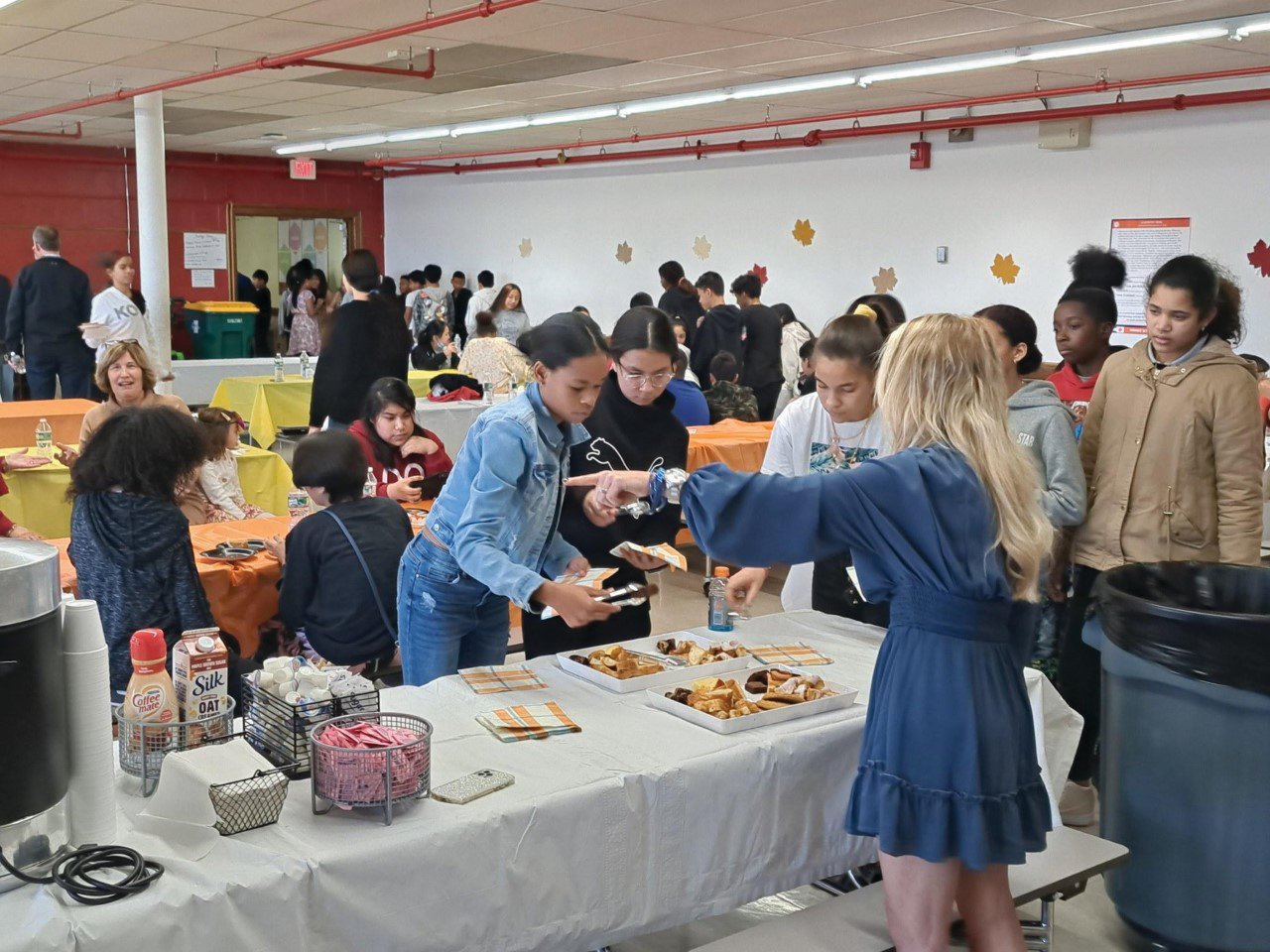TIME TO CELEBRATE: Students gather in the school cafeteria for their Thanksgiving celebration that included turkey, side dishes and -- of course -- dessert.